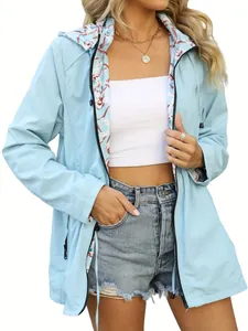 Detail view of women's light blue waterproof jacket showing elegant floral lining