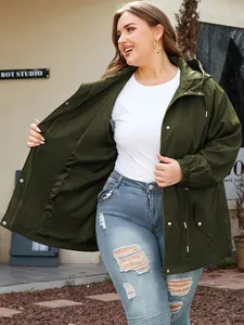 Close-up detail of women's army green hooded jacket with zipper and button closures.