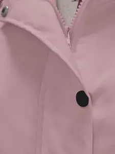 Close-up of pink waterproof outdoor jacket with zipper and snap button details