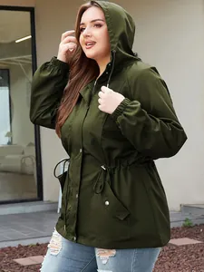 Detail view of an olive green waterproof outdoor jacket with an adjustable drawstring waist.