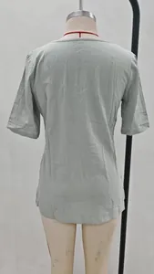 Detailed back view of women's casual short sleeve linen blouse in sage green color