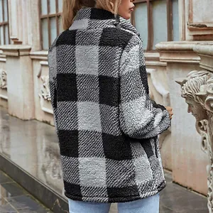 Back view of loose black and grey plaid fleece jacket showing soft fuzzy texture