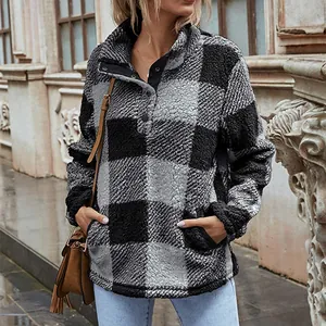 Detailed shot of a women's plaid sherpa fleece pullover with a cozy snap funnel neck