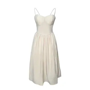 French vintage cream spaghetti strap dress with structured bodice and pleated skirt