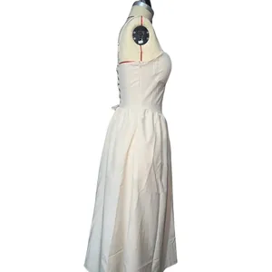 Side profile detail of an elegant French retro ivory strap maxi dress shown on mannequin