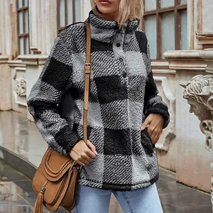 Women's plaid sherpa pullover featuring a mock neck with buttons in a stylish street setting.