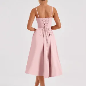 Detailed back view of a pink French retro midi dress featuring a lace-up corset design