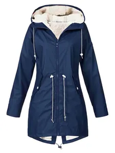 Detailed view of navy blue fleece-lined hooded jacket showing warm cream lining