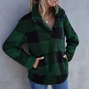 Detail of green and black plaid fuzzy fleece pullover with button collar