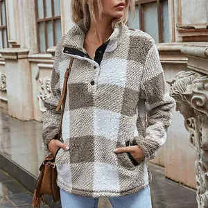 Cozy plaid fleece pullover sweatshirt for women featuring a high collar and button detail.