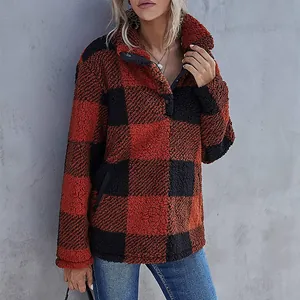 Cozy red and black buffalo plaid fleece pullover featuring a snap button collar detail