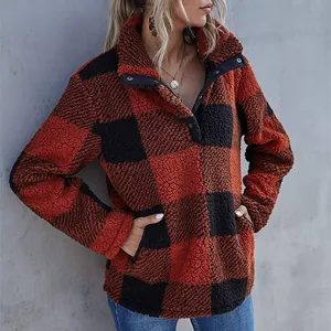 Detail view of oversized red and black buffalo plaid fleece sweatshirt with buttoned collar