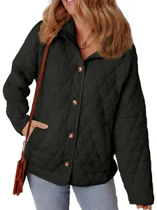 High-quality detail of women's black quilted jacket with diamond pattern and buttons