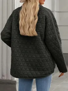 Back view of a women's dark green quilted cotton jacket with a triangle texture pattern
