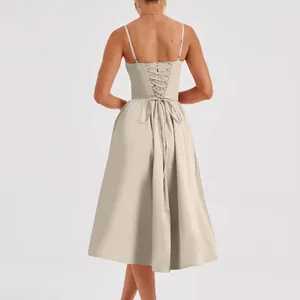 Back view of a French retro beige midi dress with elegant lace-up palace style detail