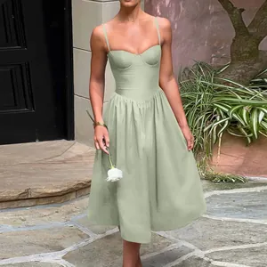 Elegant sage green bustier midi dress with delicate spaghetti straps and pleated skirt