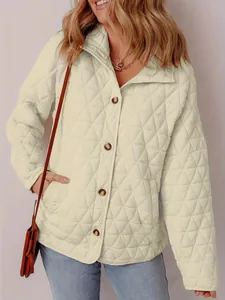 Detail view of a stylish quilted cotton jacket featuring a classic button-down front