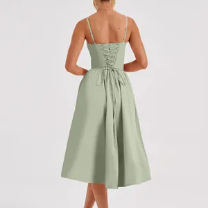 Detailed view of the elegant lace-up back design on a sage green French retro midi dress