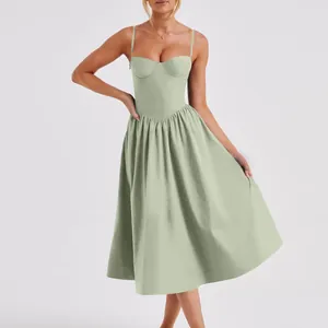 Close-up detail of a French retro sage green suspender dress with a corset style bodice