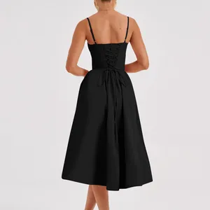 Rear view of black French vintage midi dress with elegant corset lace-up back detail