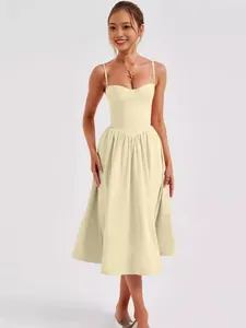 Elegant French vintage spaghetti strap midi dress in cream yellow, ideal for summer