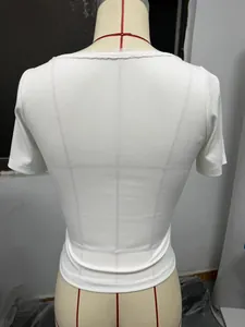 Back view of slim fit ribbed short sleeve top with delicate lace collar detail