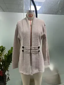 Detail of women's casual knit cardigan with double-breasted decorative buttons
