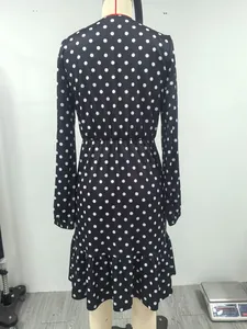 Detailed back view of a French style polka dot long sleeve dress with elastic waist