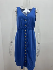 Close-up detail of a sleeveless blue dress featuring a button-down front and elastic waist.