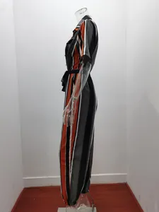 Side view of a vertical striped utility jumpsuit with lapel collar and belt