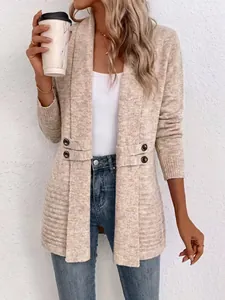 Close-up of women's beige knit cardigan featuring double-breasted strap details