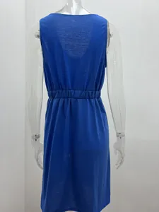 Back view of a blue sleeveless dress with an elastic waist on a clear mannequin