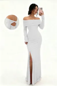 Detailed view of white off-the-shoulder long sleeve maxi dress with side slit