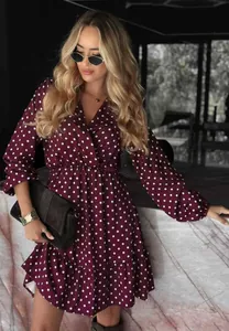 Close-up of French style burgundy polka dot V-neck midi dress with long sleeves
