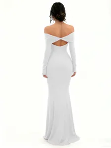 Back view of white off-the-shoulder long sleeve maxi dress showing cutout detail