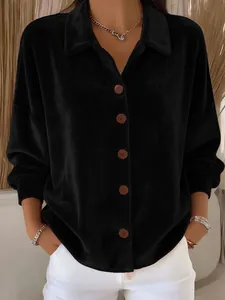 Close-up of black velvet long sleeve shirt featuring elegant texture and button-up front