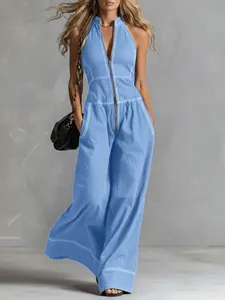 Detailed view of light blue wide-leg sleeveless jumpsuit with white contrast stitching.