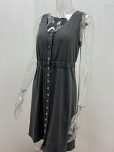 Close-up detail of a dark gray sleeveless button-down dress with an elasticated waist