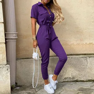 Detailed view of a purple short sleeve cargo jumpsuit with waist belt and lapel collar