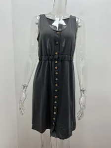 Detailed front view of charcoal grey sleeveless button-down dress with cinched waist