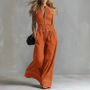 Chic orange sleeveless high-neck wide-leg jumpsuit with white contrast stitching