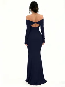 Back view of elegant navy off-shoulder dress with twist cut-out detail
