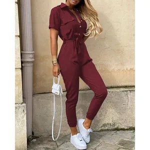 Chic burgundy short sleeve utility jumpsuit with adjustable waist belt and collar detail
