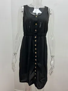 Detail shot of a black sleeveless summer dress featuring button front and elasticated waist.