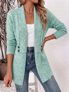 Detailed view of women's mint green knit cardigan featuring decorative side button straps