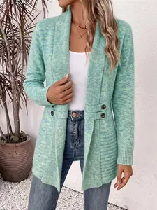 Detail view of a green melange knit cardigan with decorative buttons and shawl collar
