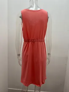 Back view of a coral pink sleeveless mini dress with an elastic waist on a mannequin