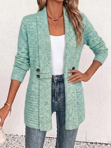 Detail view of the mint green textured knit cardigan with double-breasted accents