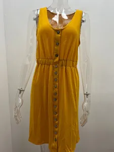 Close-up detail of a yellow sleeveless button-down dress featuring an elastic waist