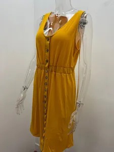 Close-up of yellow V-neck sleeveless dress with button-down front and elastic cinched waist.